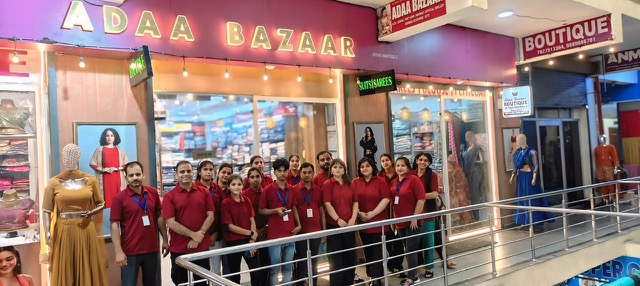 The Adaa Bazaar boutique at Jagat Farm, Greater Noida, with its staff
                      outside the shopfront